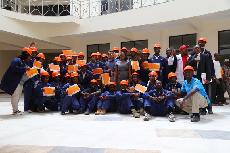 Crown Paints Group Marketing Manager, Nilesh Gosavi poses with the Housing Finance Graduates.