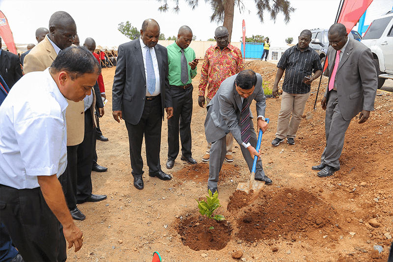 Crown Paints CEO, Rakesh Rao plants a tree at the new factory compound to mark the official opening.